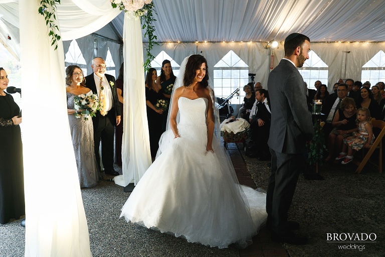 Stephanie taking laps around Loren at Jewish wedding ceremony