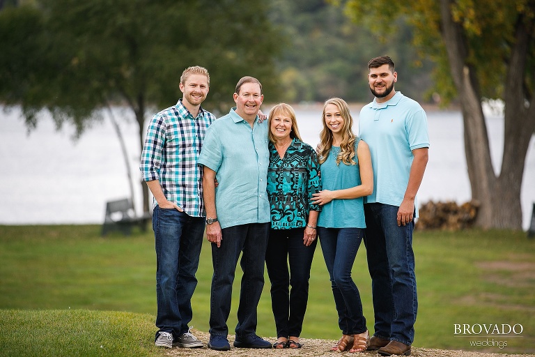 Anderson Family posing in front of St. Croix River in Stillwater