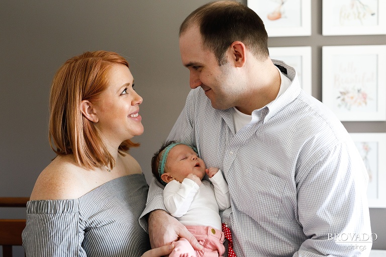 April and Mike smiling with baby Nellie
