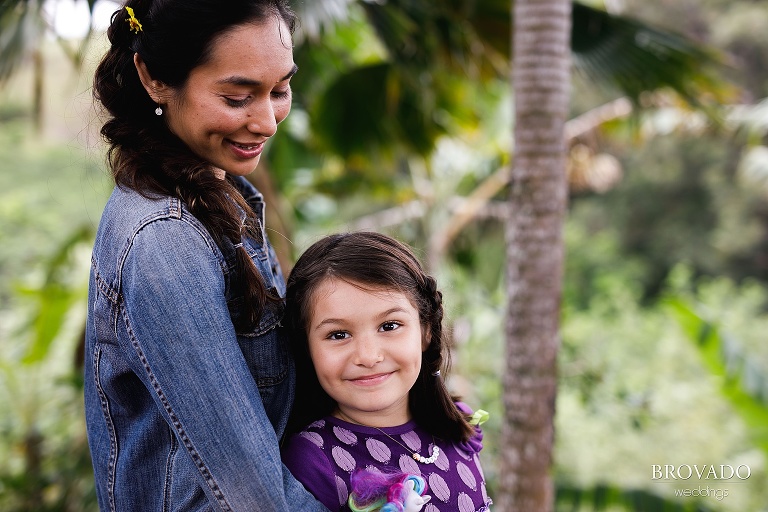 Olyvia smiling while Ashley looks down at her