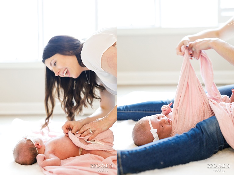 bright photographs of a newborn being swaddled in a pink blanket