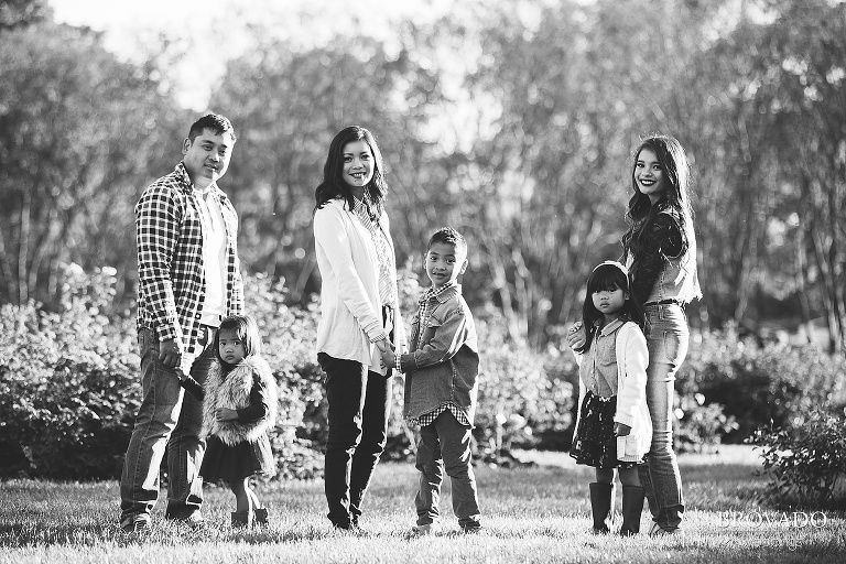 Family holding hands in black and white