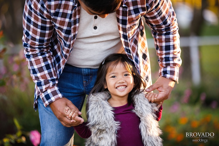Boone holding his daughter's hands