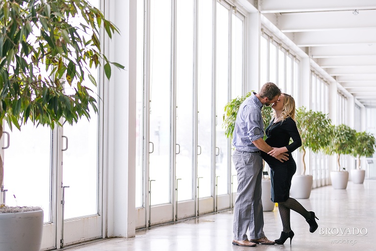 Sarah and Cody kissing in como conservatory