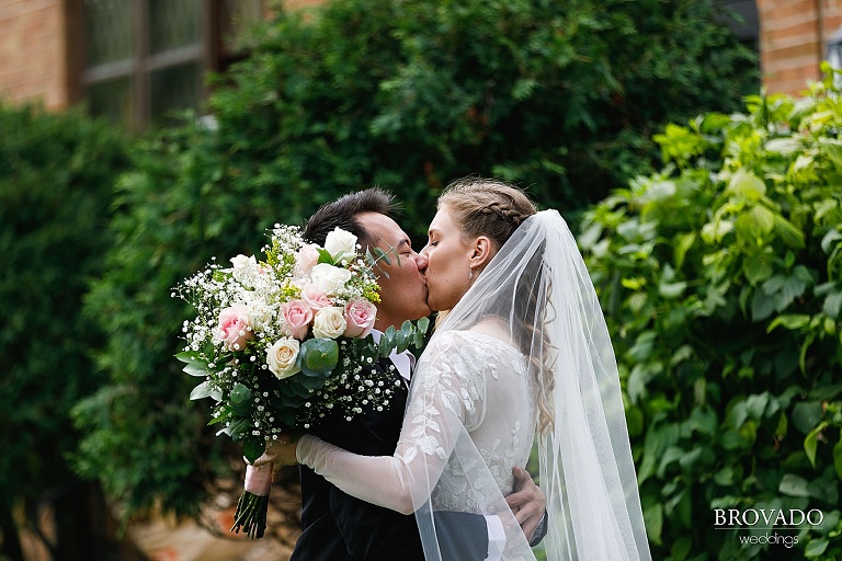 Bride and groom kiss after first look