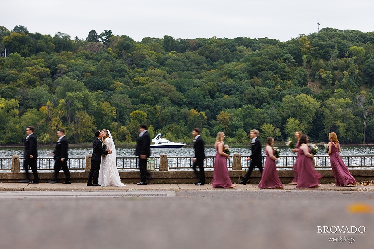 Wedding party walking along st croix river