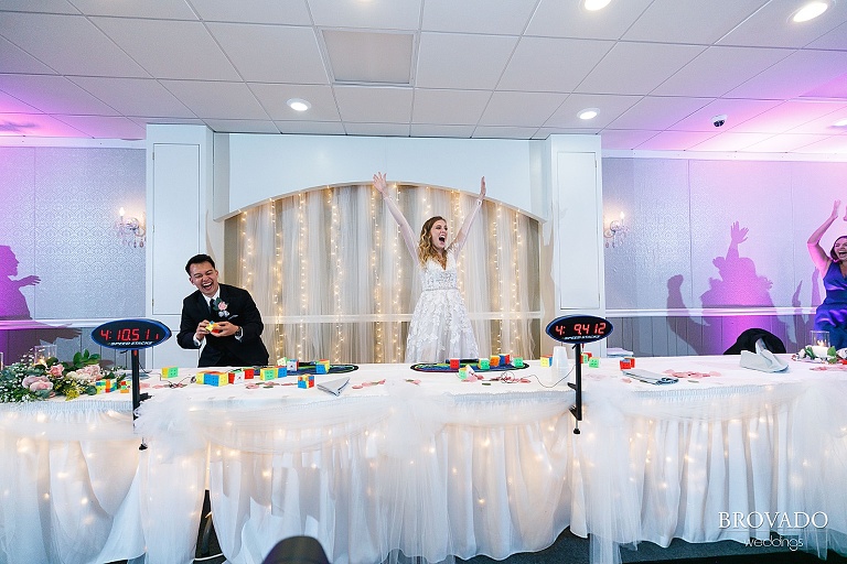 Bride winning speedcubing at wedding reception