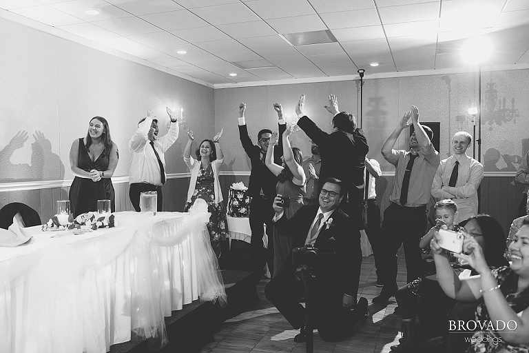 Wedding guests cheering