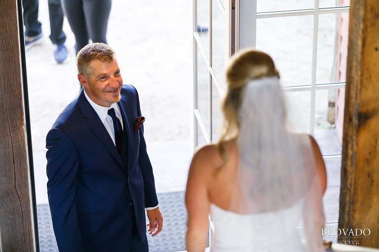 Father of the bride smiling at his daughter