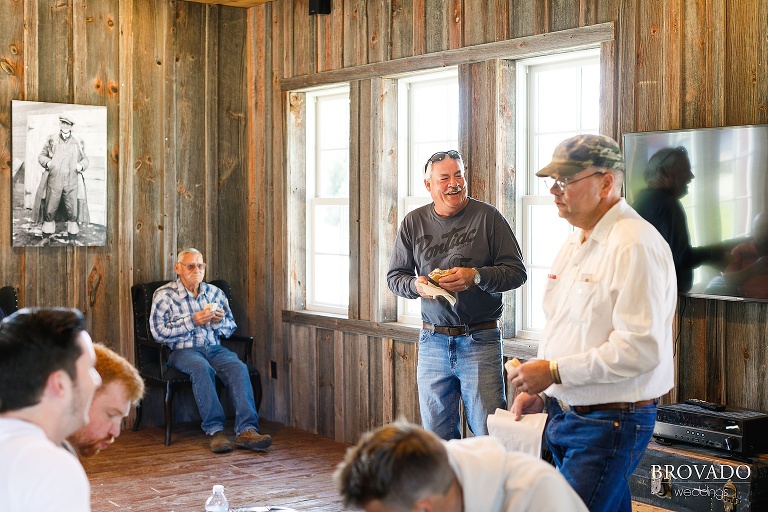 Groomsmen enjoying sandwiches before ceremony