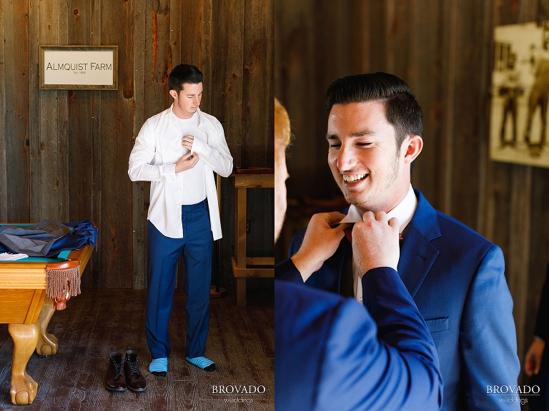 Portraits of groom getting dressed in blue suit