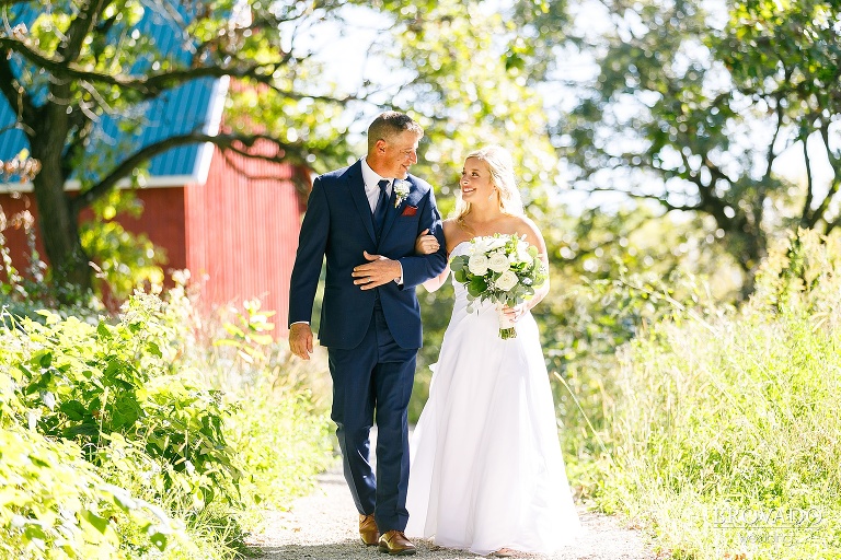 Bride and her father walking down the aisle at almquist farm