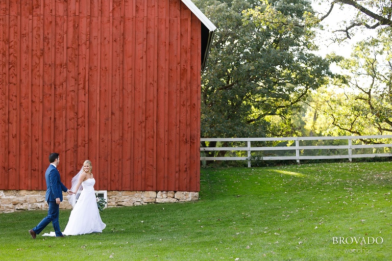 Bride leading groom into almquist farm reception