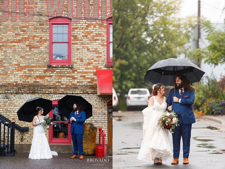 Bride and groom standing under umbrellas