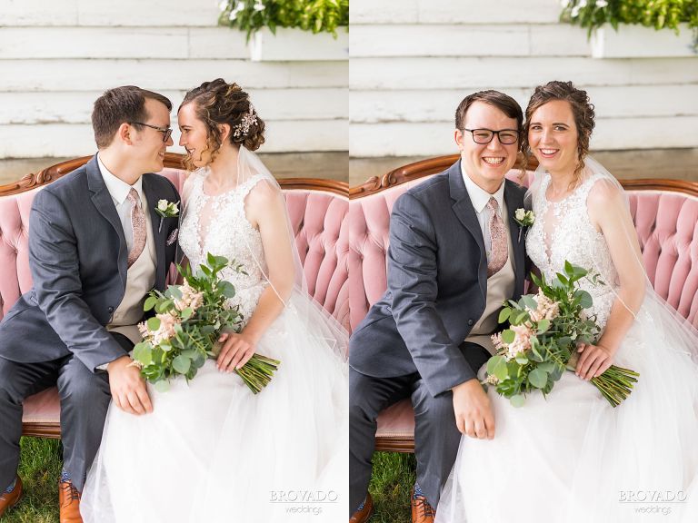 Heather and Daniel smiling together on a pink velvet couch