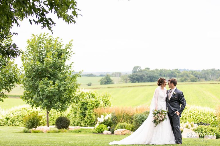 Wide angle of Heather and Daniel smiling and embracing