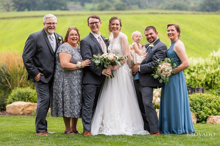 Heather and Daniel posing with groom's family 