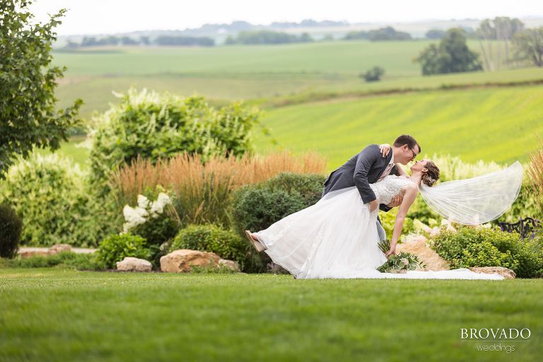 Daniel dipping Heather while her veil flies in the wind