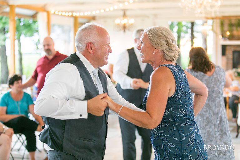 Mother and father of the bride dancing together
