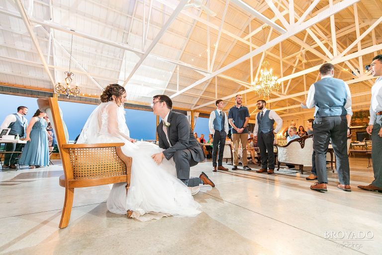 Daniel taking off the bride's garter