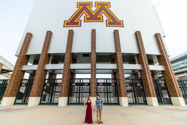 Engagement pose in front of the u of m