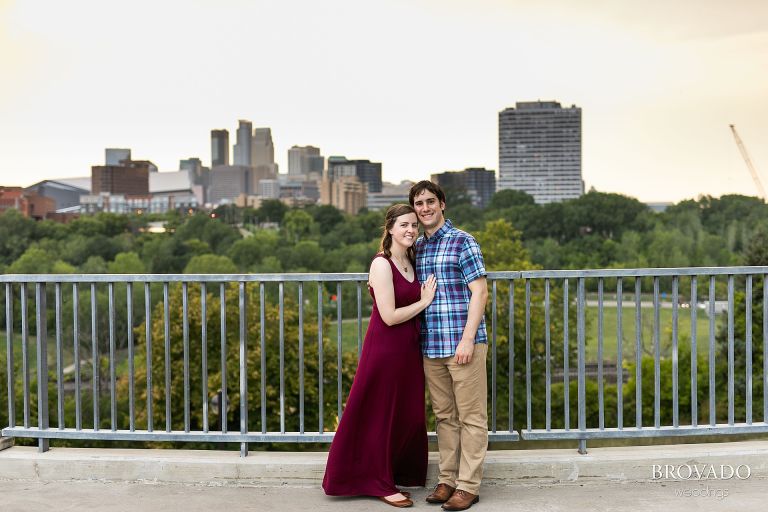 Jeanette and Kevin posing in front of minneapolis skyline