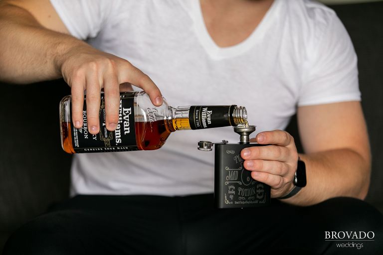 Bourbon being poured into a Harry Potter flask