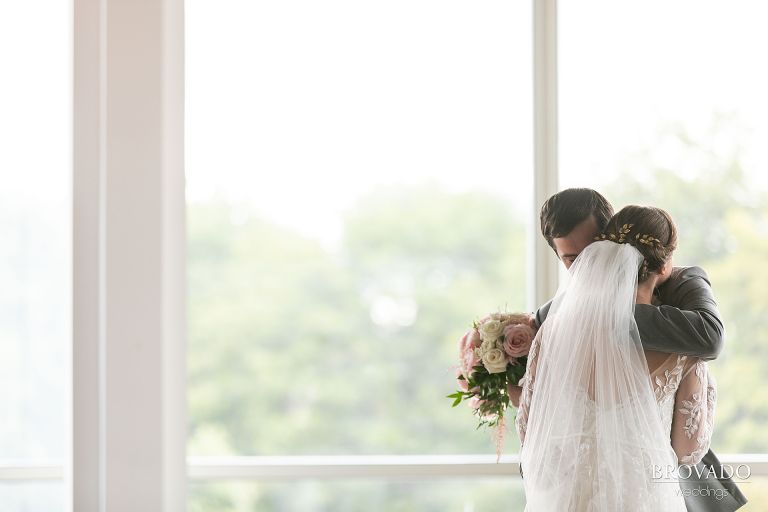 Couple embraces after first look