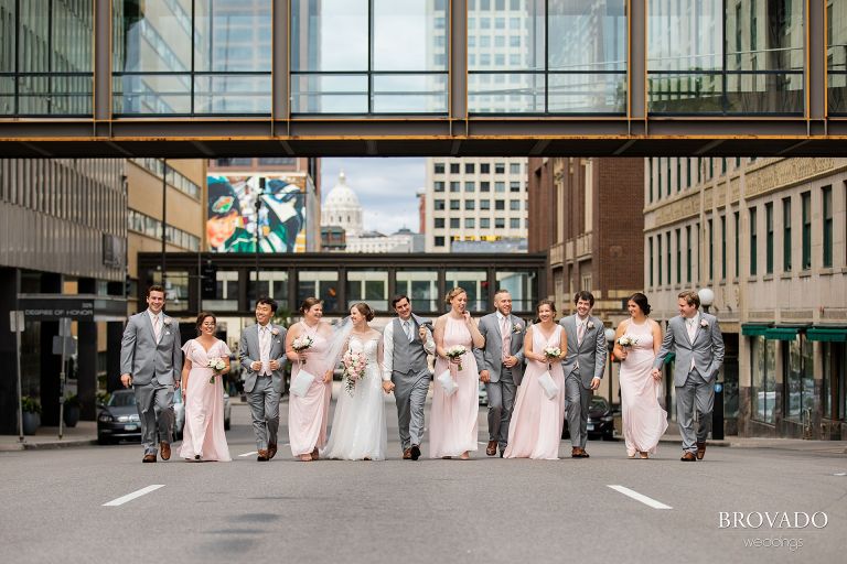 Wedding party walking down street in front of mn capitol