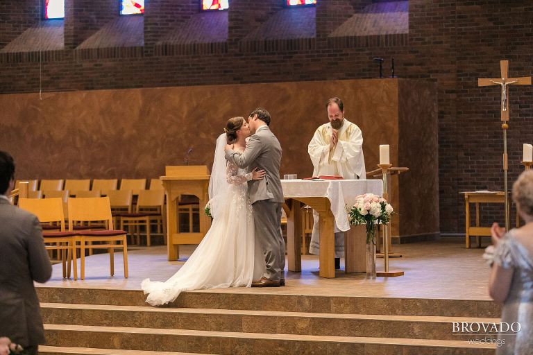 Bride and groom first kiss