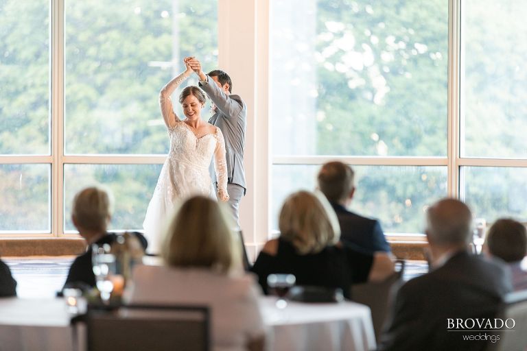 Groom twirling the bride