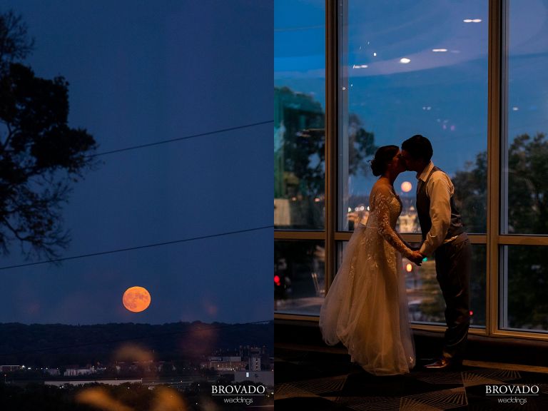 Bride and groom kissing in front of full moon