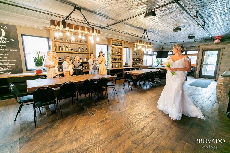 Bridal party taking photos of bride