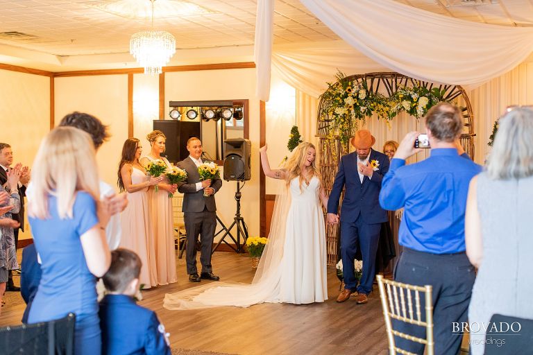 Bride and groom cheering